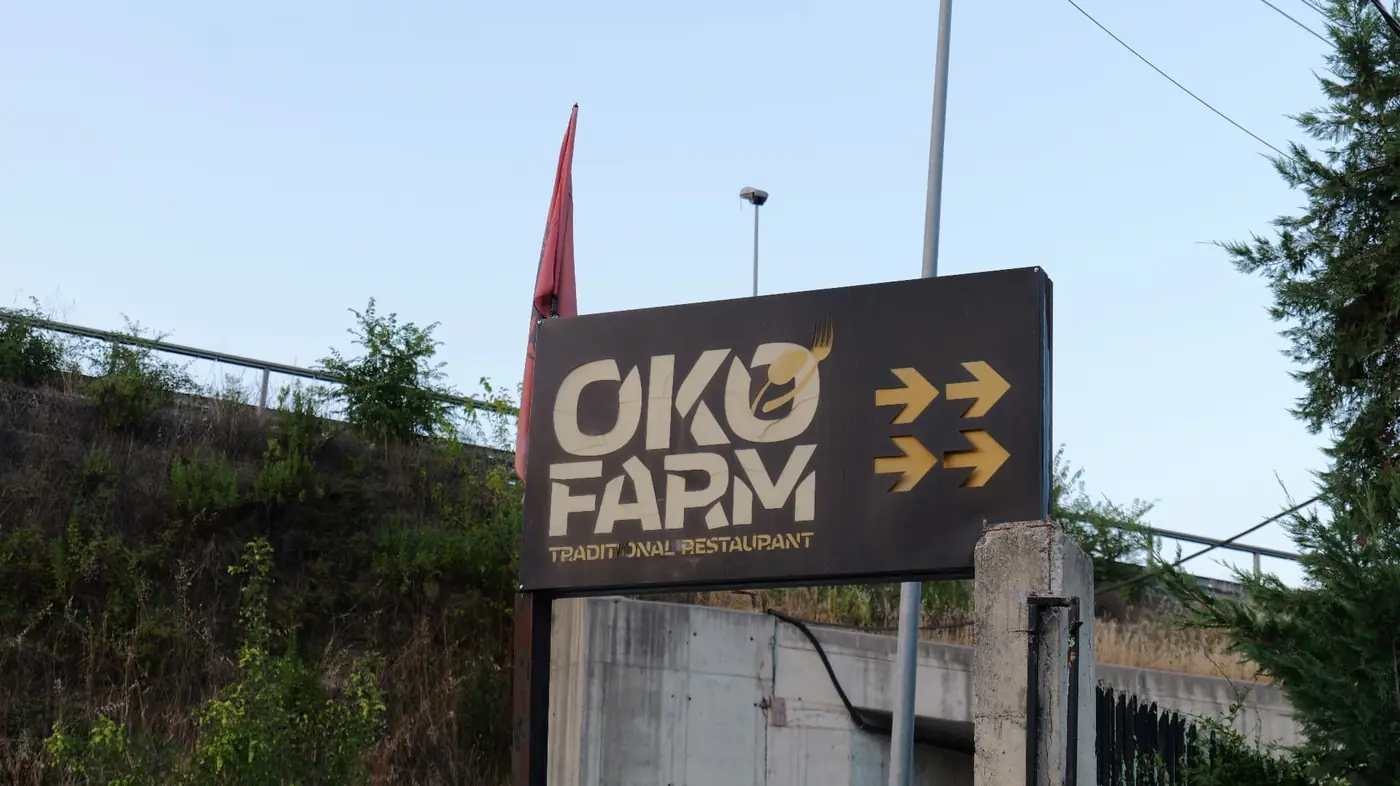 OKO Farm Traditional Restaurant road sign near the highway exit