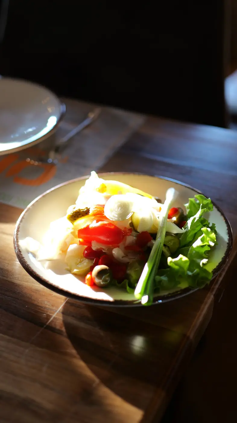 Fresh village salad with tomatoes, olives, white cheese and lettuce
